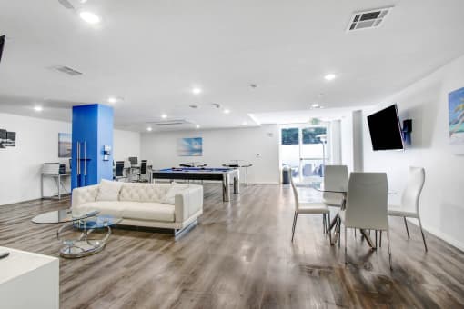 a living room and dining room with a pool table