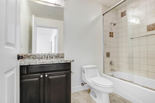 a bathroom with a sink toilet and a shower