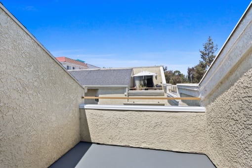 the view of the roof of a building from a balcony