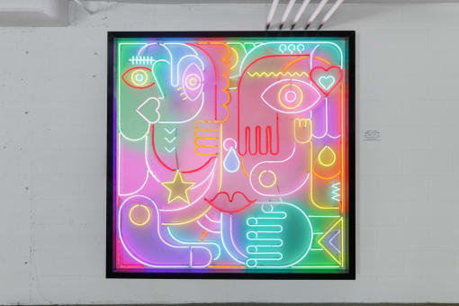 a painting on a wall in a black frame art print on