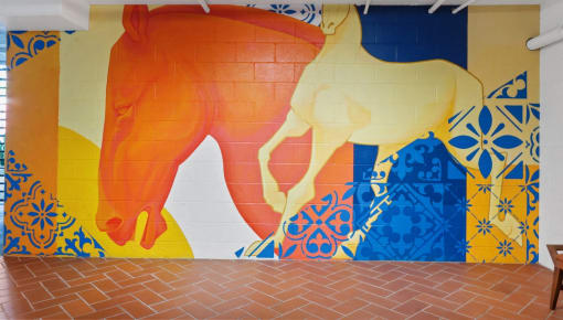 a mural of a horse on the wall of a building