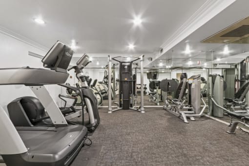 a gym with treadmills and other exercise equipment