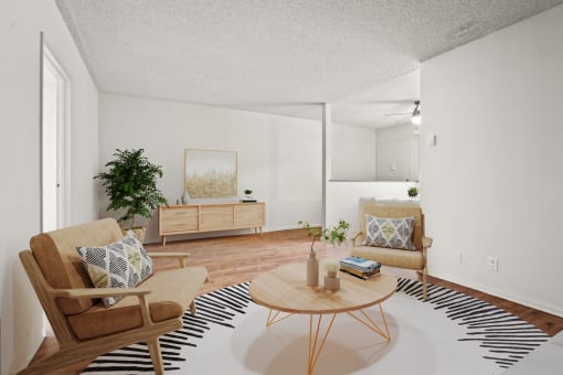 a living room with a table and chairs and a zebra rug