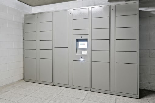 a row of stainless steel lockers in a room