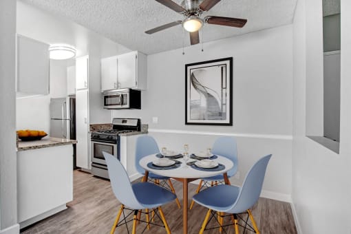 our modern kitchen and dining room with a table and chairs