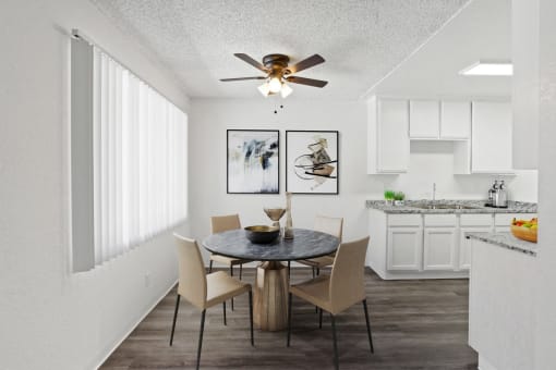 our apartments offer a dining room and kitchen with a ceiling fan