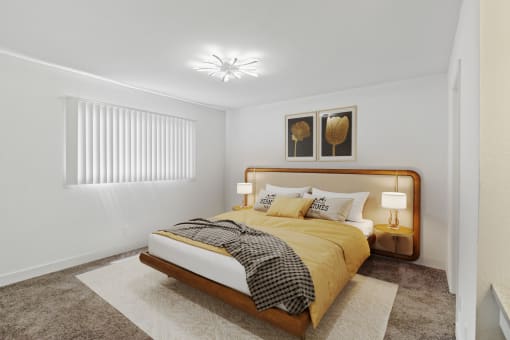 a bedroom with a bed and two lamps