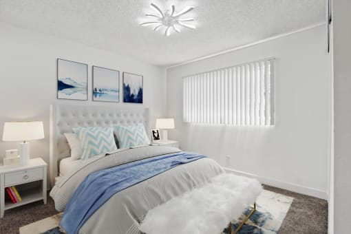 a bedroom with a bed and a window