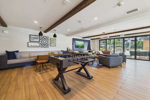 A modern kitchen with a wooden floor and a large island.