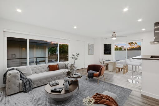 a living room with a white couch and a table