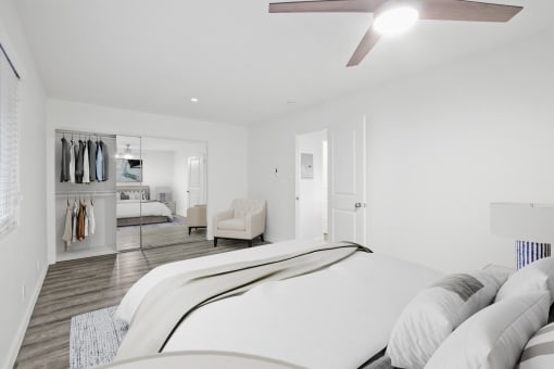 a bedroom with a large bed and a closet