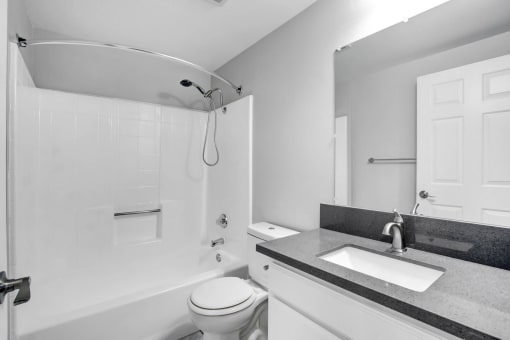 a bathroom with a sink toilet and a shower