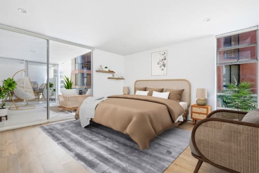 a bedroom with a bed and a sliding glass door