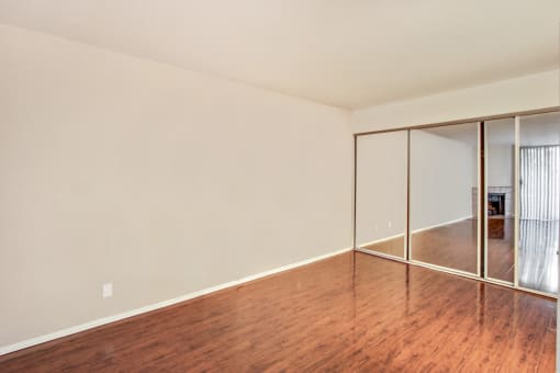 Bedroom With Mirrored Closet Doors