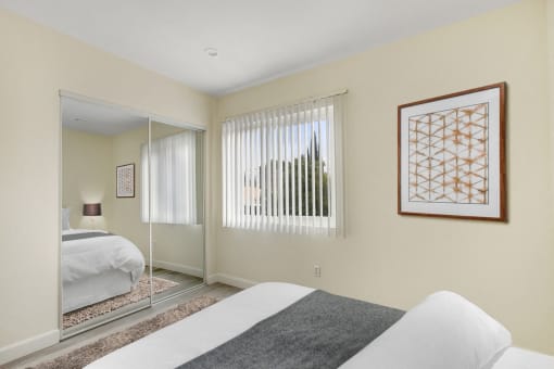 Bedroom With Mirrored Closet