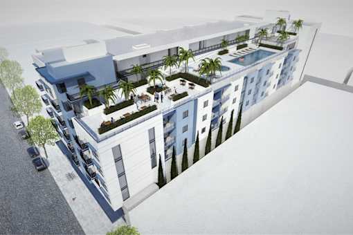 A modern building with a pool and palm trees.