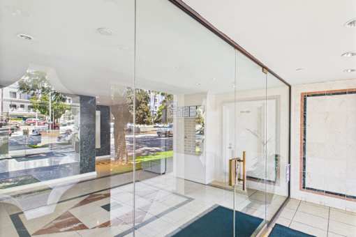 A glass wall with a view of the street outside.