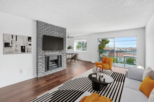 a living room with a fireplace and a striped rug