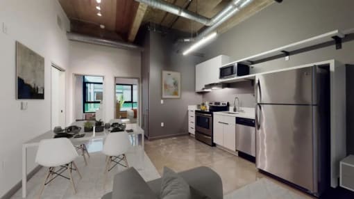 a kitchen and a living room in a room