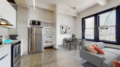 a kitchen and living room with a large window