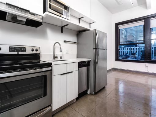 a kitchen with a stove top oven next to a refrigerator