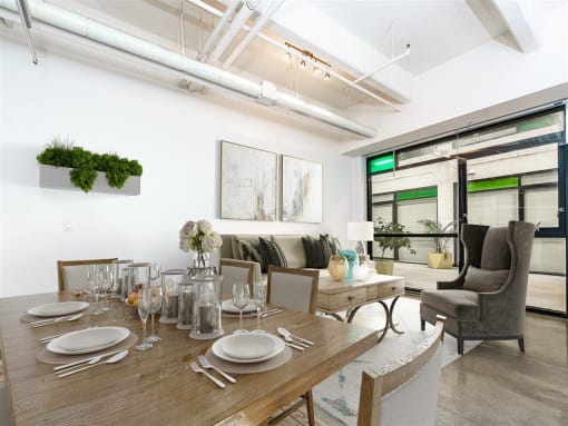 a dining area with a wooden table and chairs