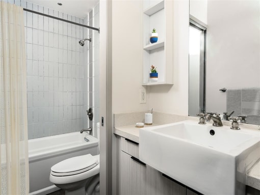 a bathroom with a sink toilet and bathtub