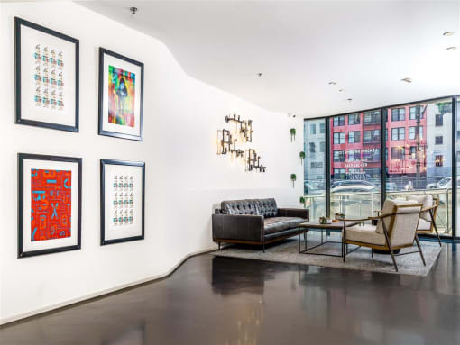Apartments In Downtown Los Angeles For Rent - Mercantile Lofts - Living Room With Polished Concrete Flooring, Floor-to-Ceiling Windows with Beautiful Natural Light, And City Views
