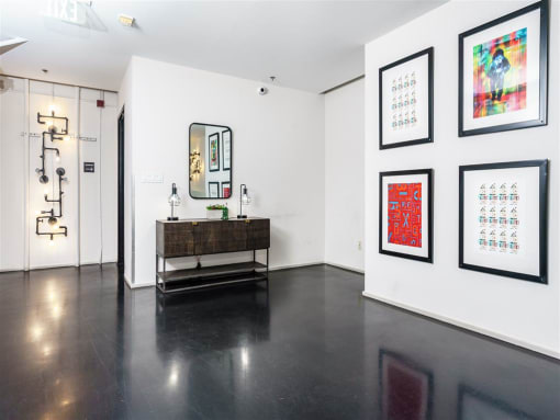 a room with white walls and black floors