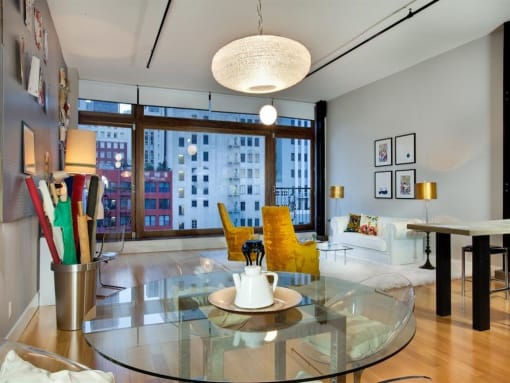a living room filled with furniture and a large window