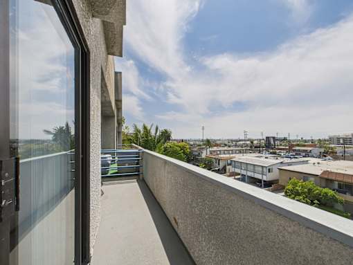 A balcony with a view of the cityscape.