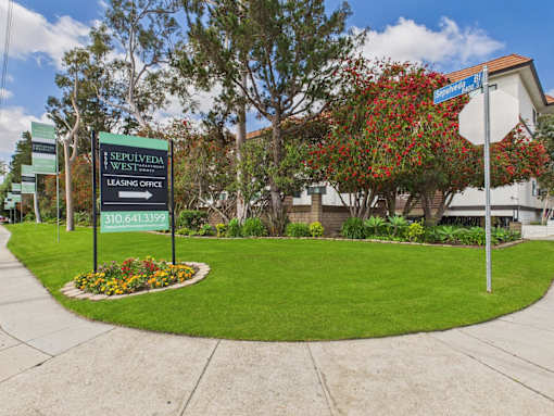 A leasing office sign for Sepulveda West is in front of a building.