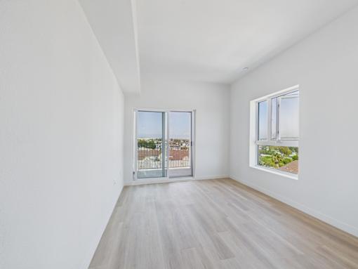 A room with a window and a door.