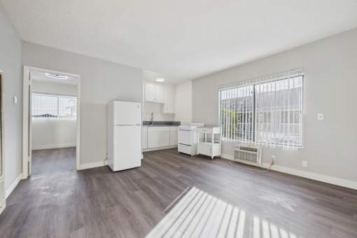 A kitchen with white appliances and a white refrigerator.