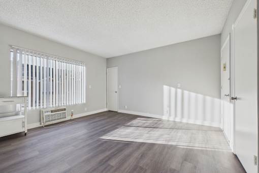 A room with a window and a door.