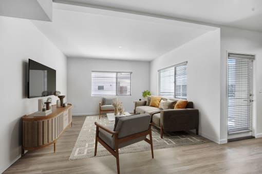an open living room with a couch and a tv