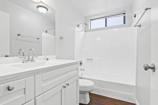 a bathroom with a sink toilet and a shower