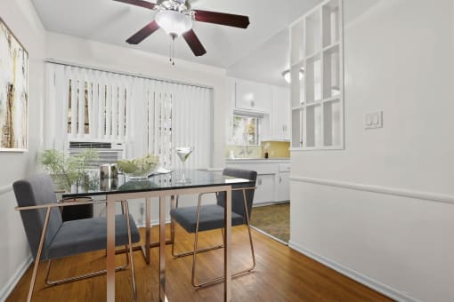 an open kitchen and dining room with a table and chairs