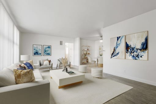 a living room with white furniture and a white rug