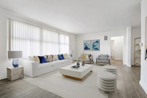 a living room with a white couch and a coffee table
