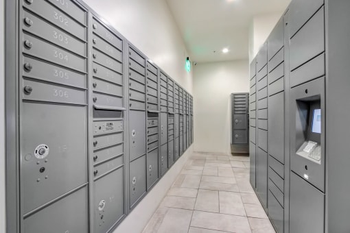 a row of gray lockers with a computer in the middle