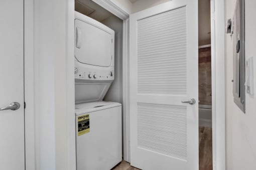 a small laundry room with a washer and dryer