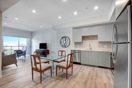 a kitchen and dining area in a 555 waverly unit