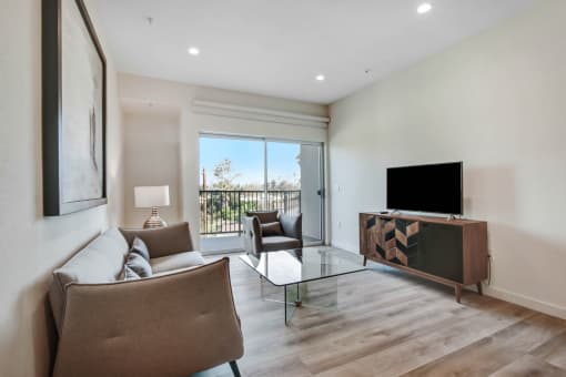 a living room with a couch and a tv