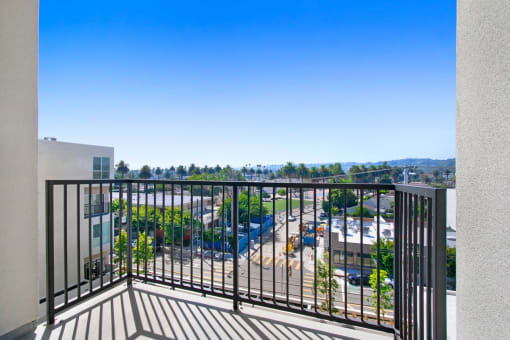 a balcony with a view of a parking lot