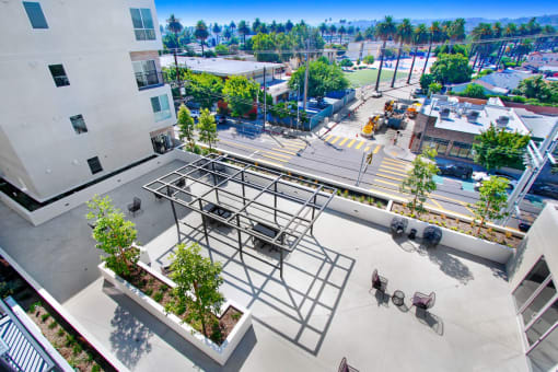 an aerial view of an apartment complex with a construction site in the background