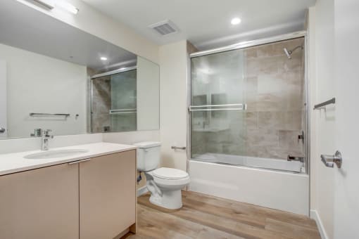 a bathroom with a toilet sink and bathtub
