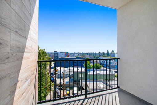 a balcony with a view of the city
