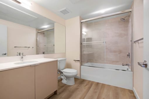 a bathroom with a toilet sink and bathtub