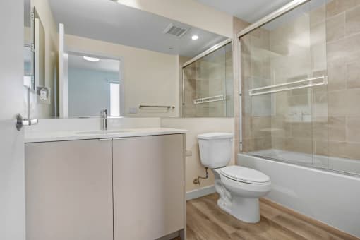 a bathroom with a toilet sink and bathtub